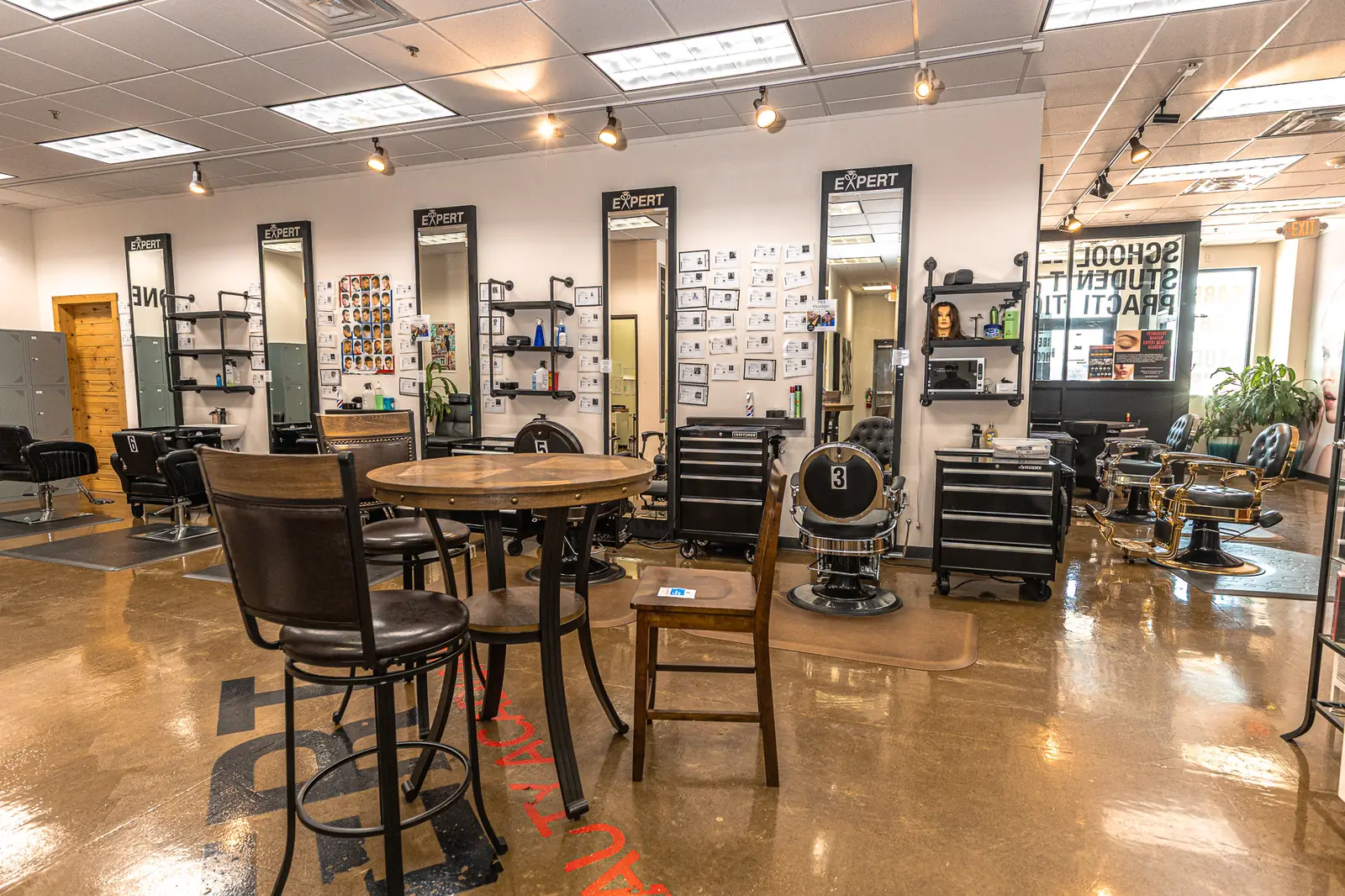 Training clinic floor with Expert mirrors and barber chairs at Expert Barber Beauty Academy